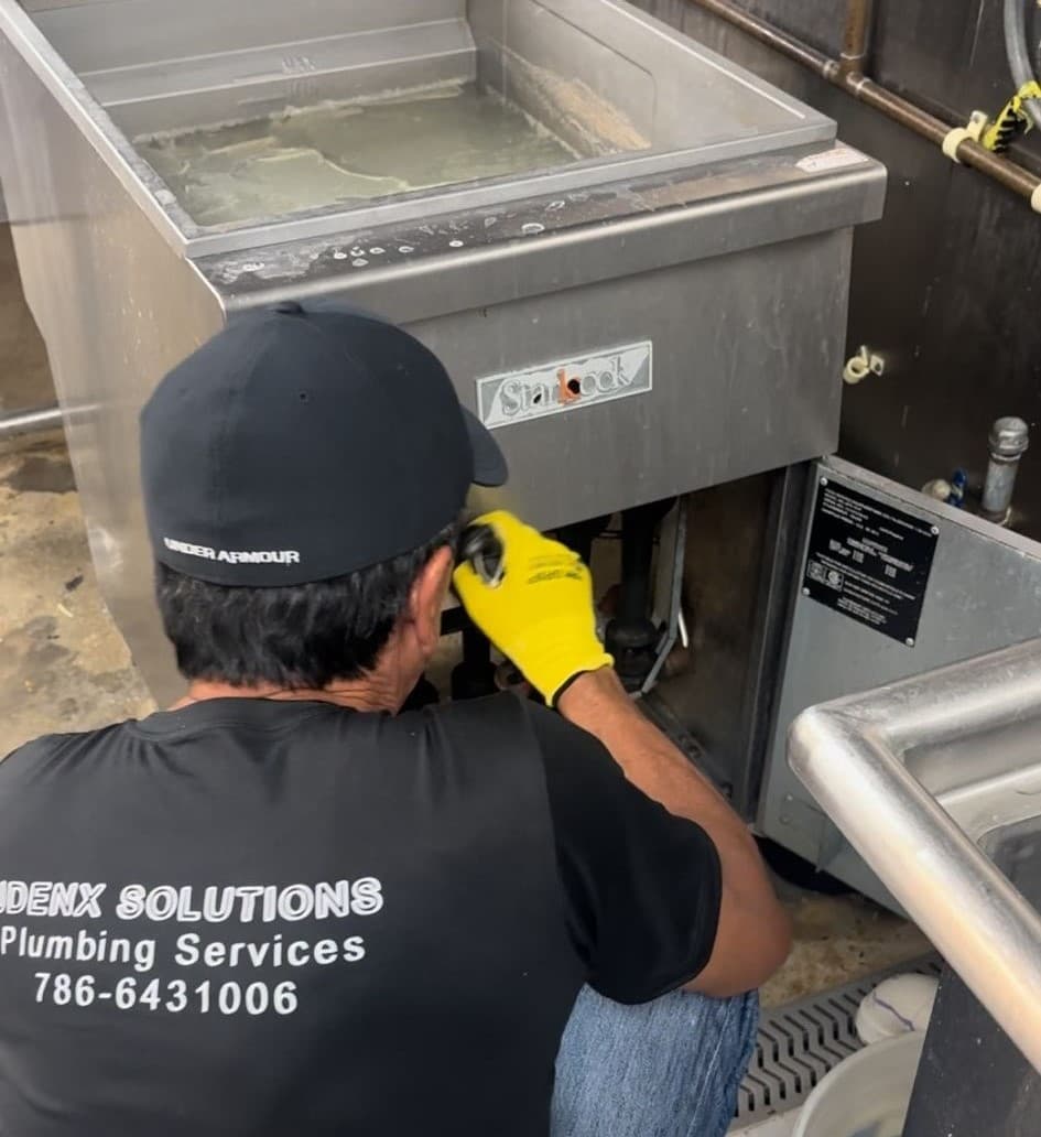 Plumber in Miami working on a project